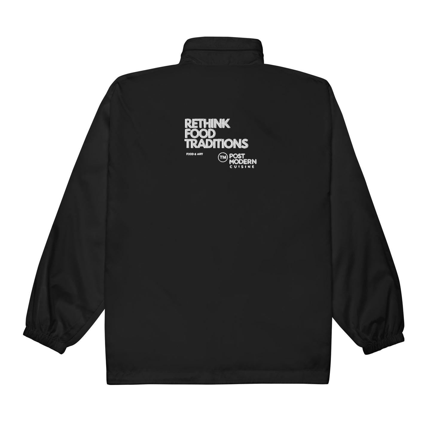 Back view of black chef windbreaker with Rethink Food Traditions embroidered text
